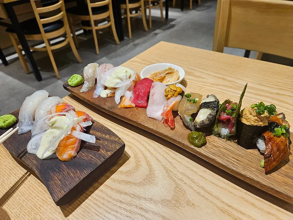 12-piece omakase sushi on a wooden plate