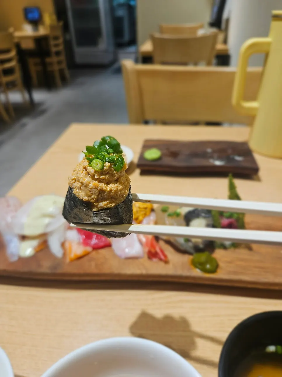 Sushi selection including uni, abalone, and gunkan-style sushi