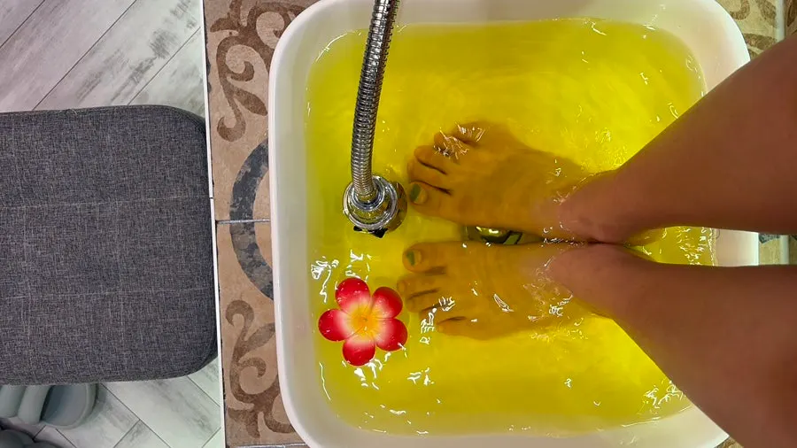 Feet soaking in warm water during the foot bath
