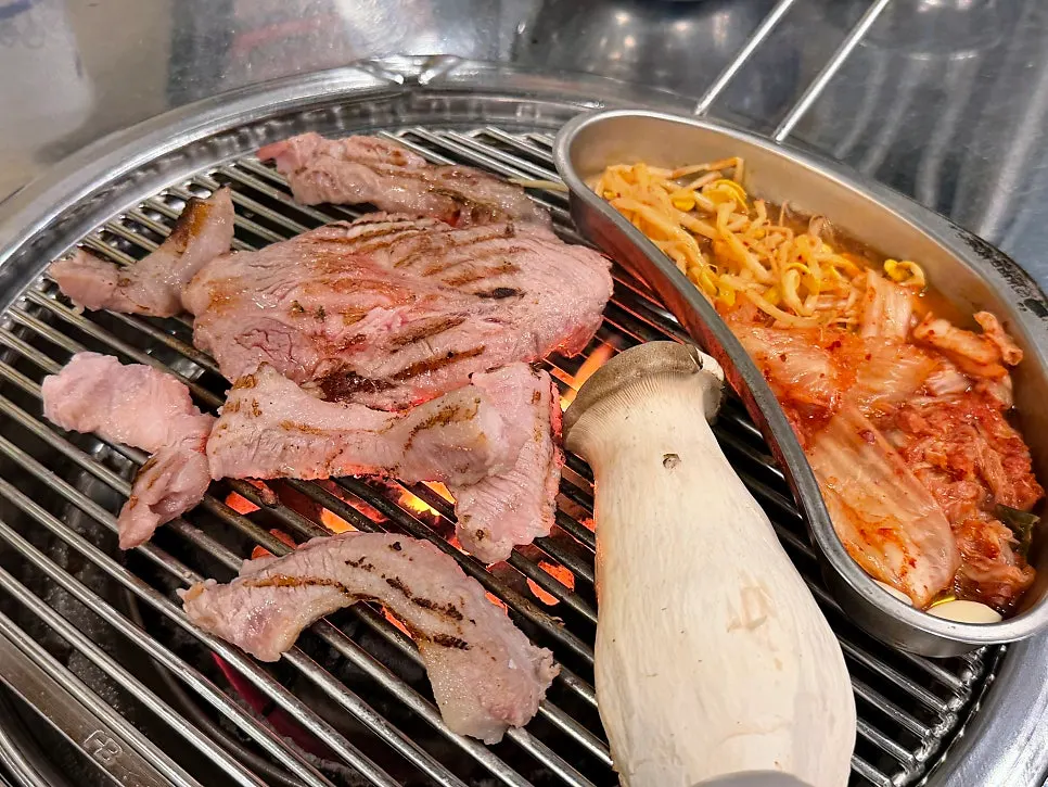 Pork belly placed on the charcoal grill