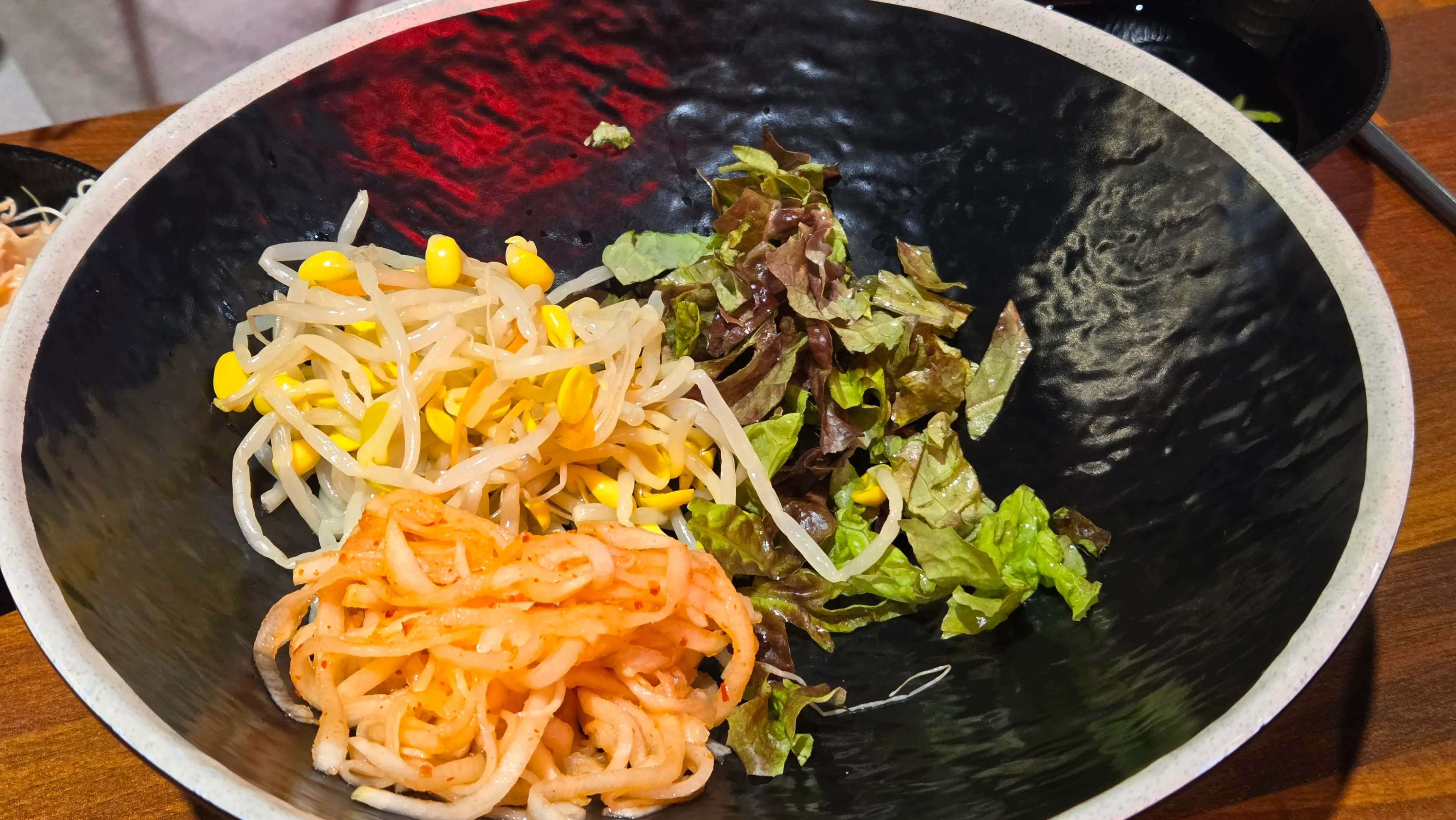 Cold cucumber soup and bibimbap side dishes