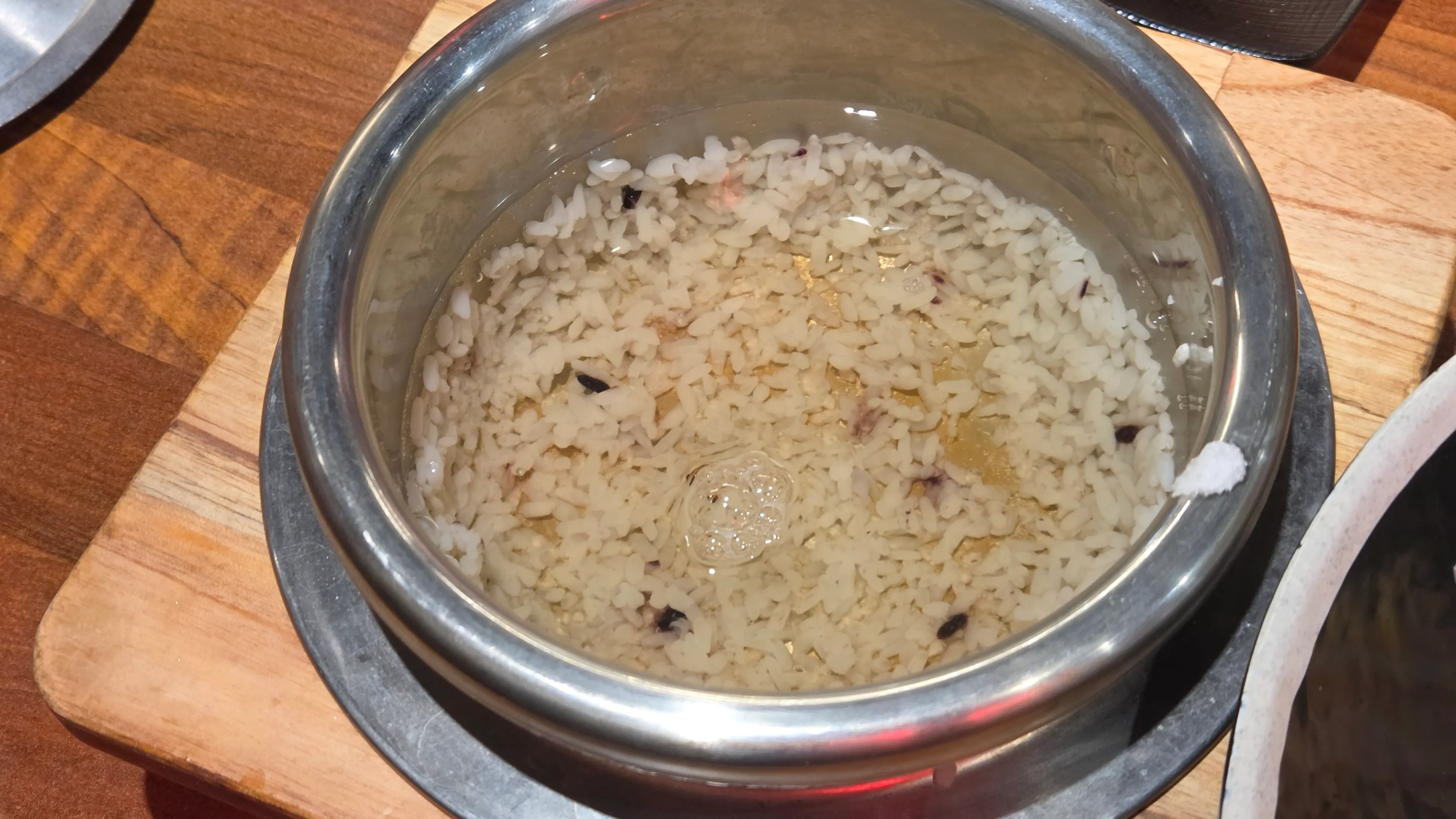 Pot rice next to the bibimbap bowl