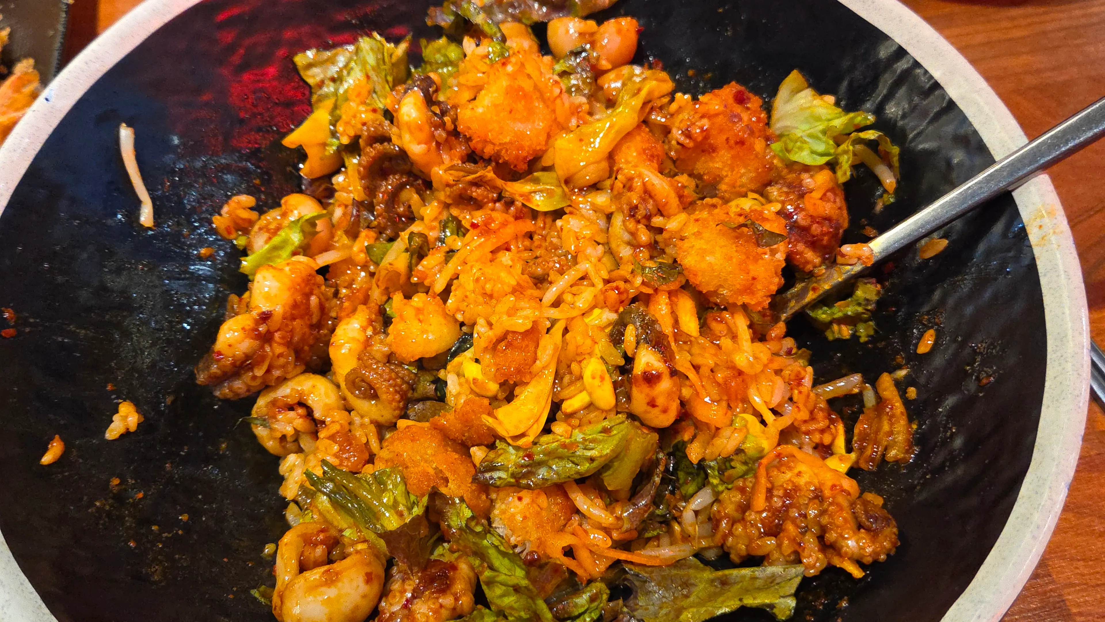 Jjukkumi bibimbap with shrimp tempura mixed in
