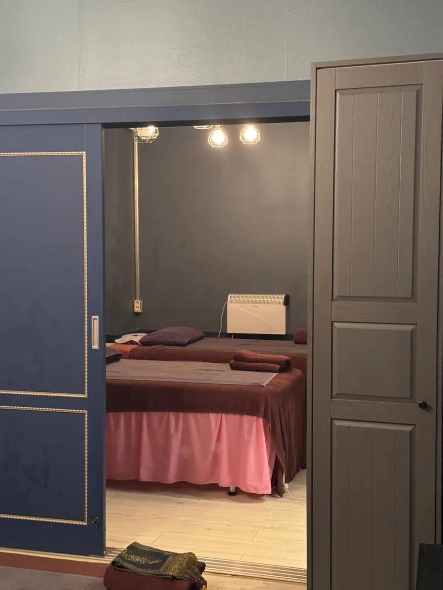 Inside the single room with massage gown and towels prepared