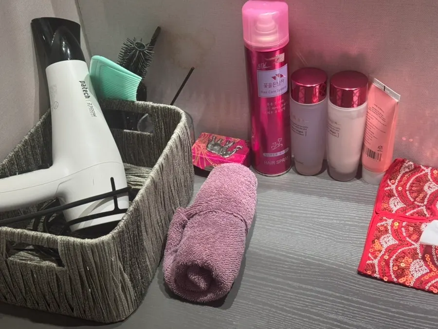 Separate men's and women's shower rooms at Puan Massage