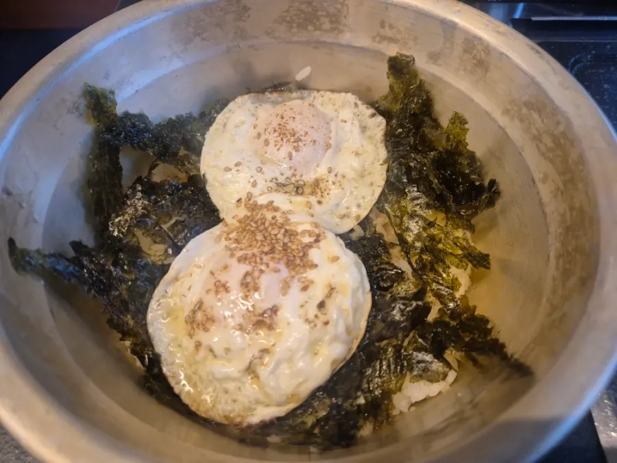 Soy sauce egg rice topped with a soft-set egg