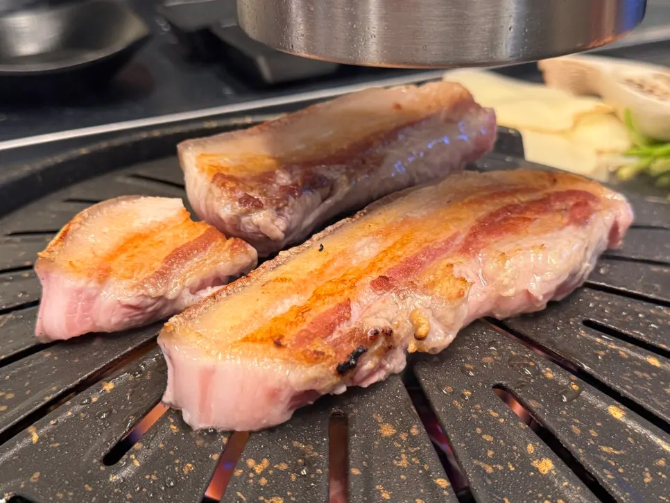 Black pork belly grilling on the pan