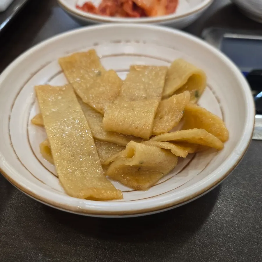 Close-up of the rich beef-bone broth budae-jjigae