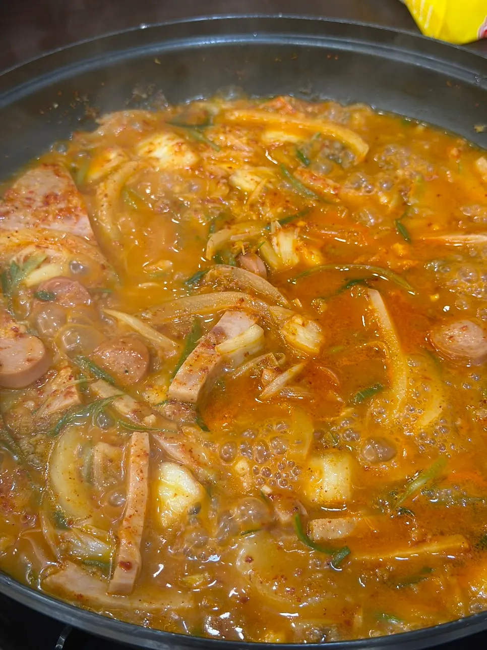 Ham and sausage from the budae-jjigae served over white rice