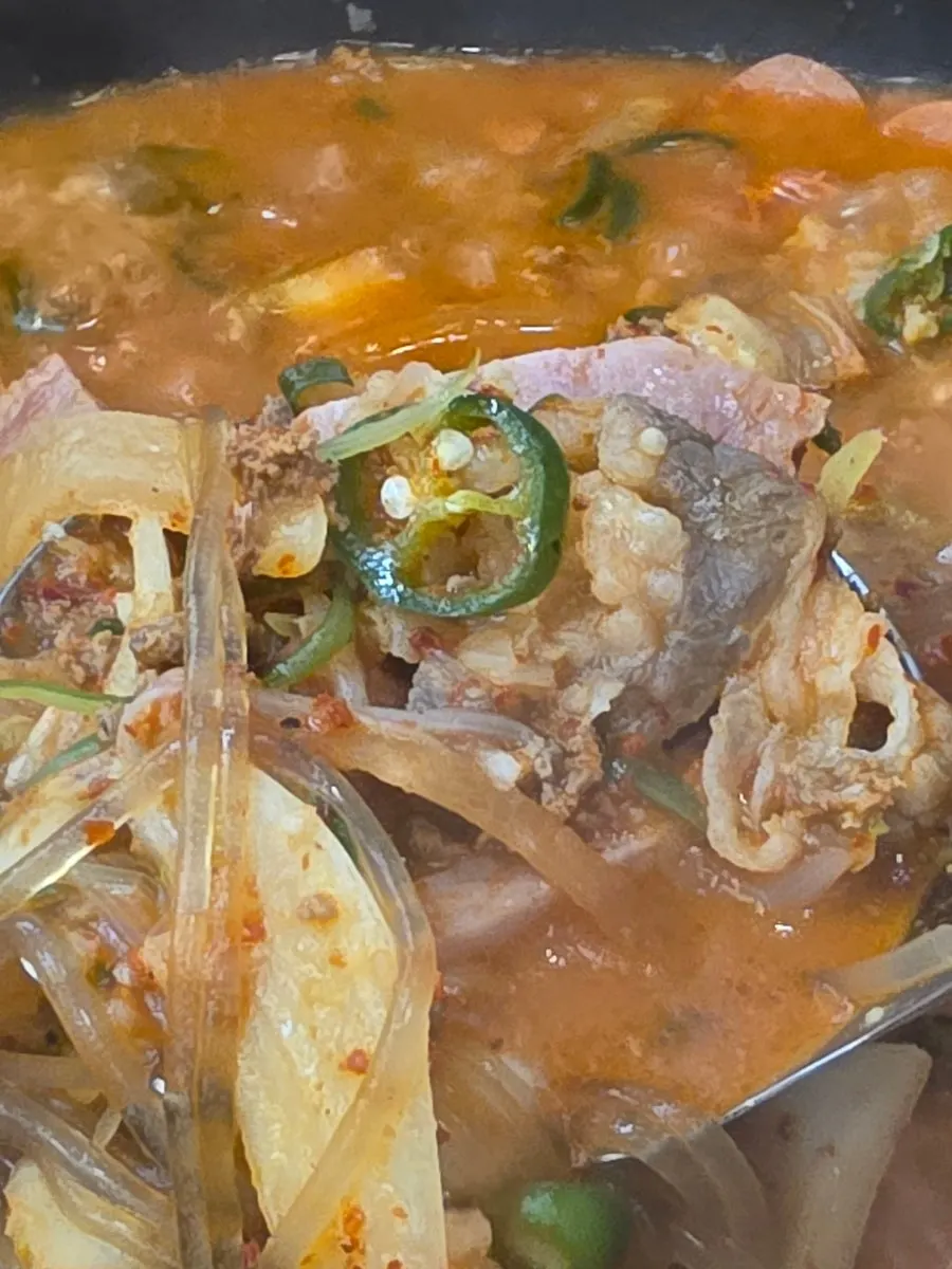 Budae-jjigae ingredients placed on top of rice