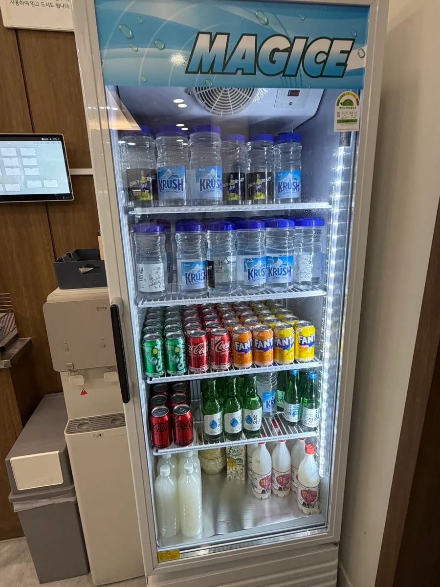 Interior of the drinks fridge lined with beverages