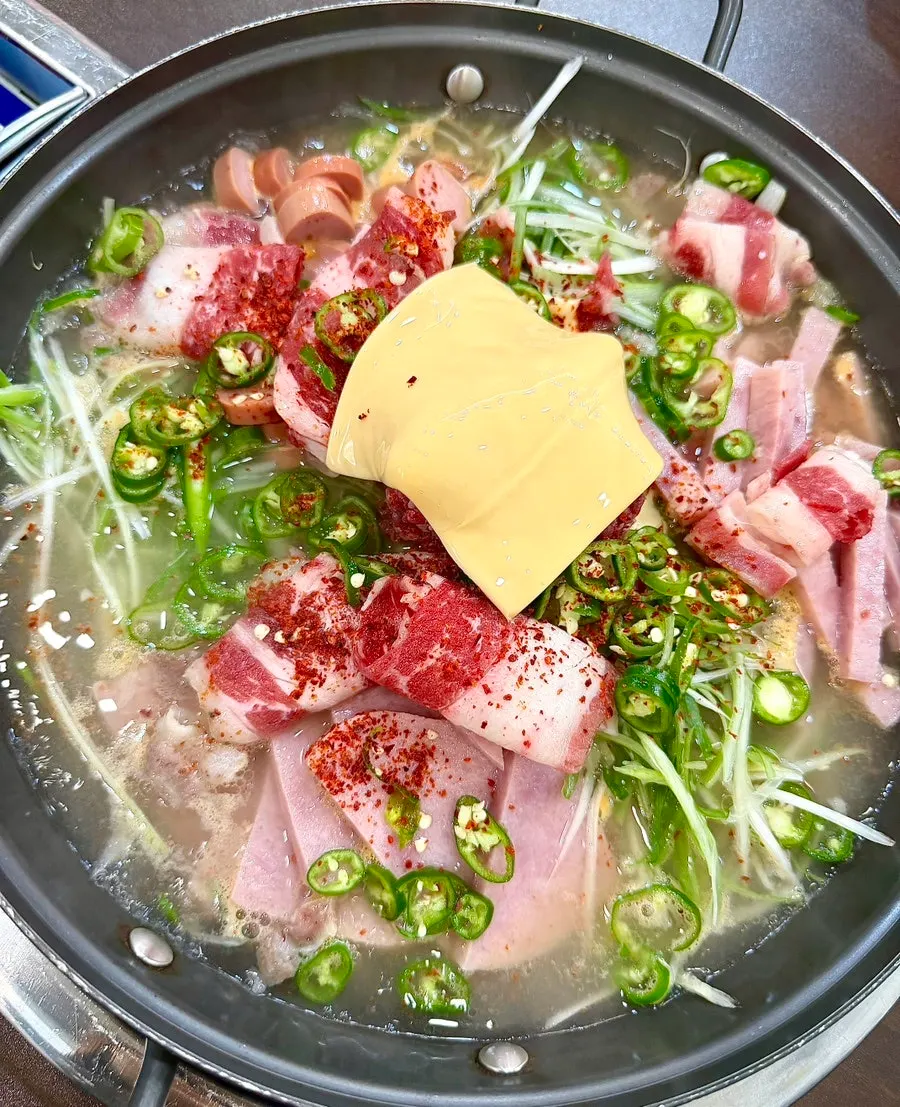 Budae-jjigae boiled and stirred together by staff