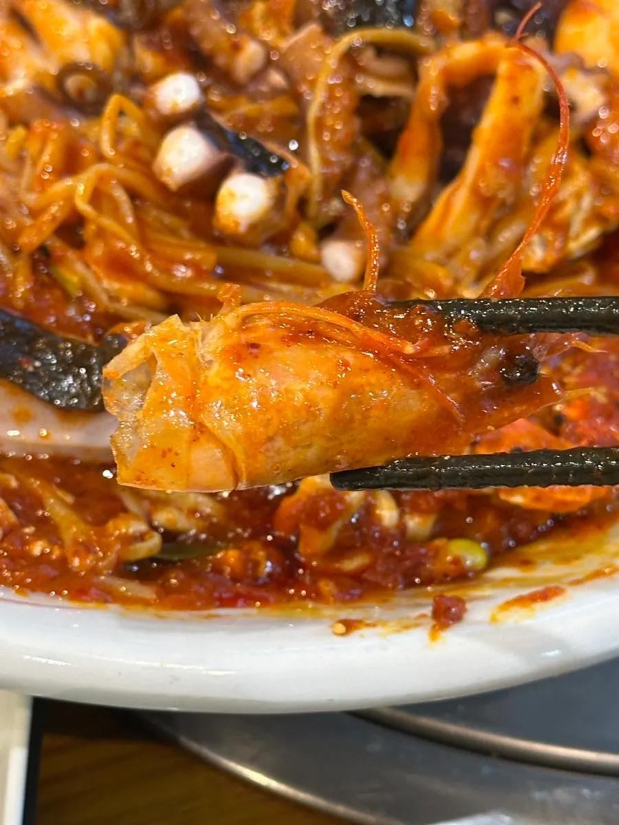 Seafood stew plate cut up by staff for easy eating