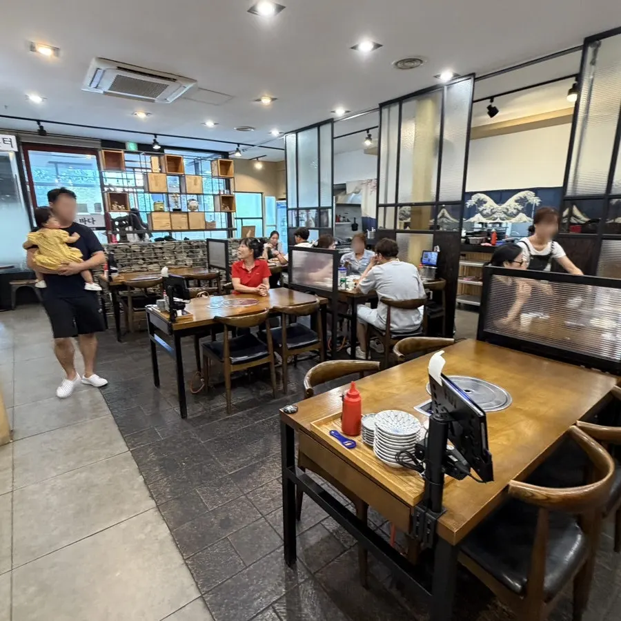 Interior of a restaurant serving seasonal seafood and grilled fish