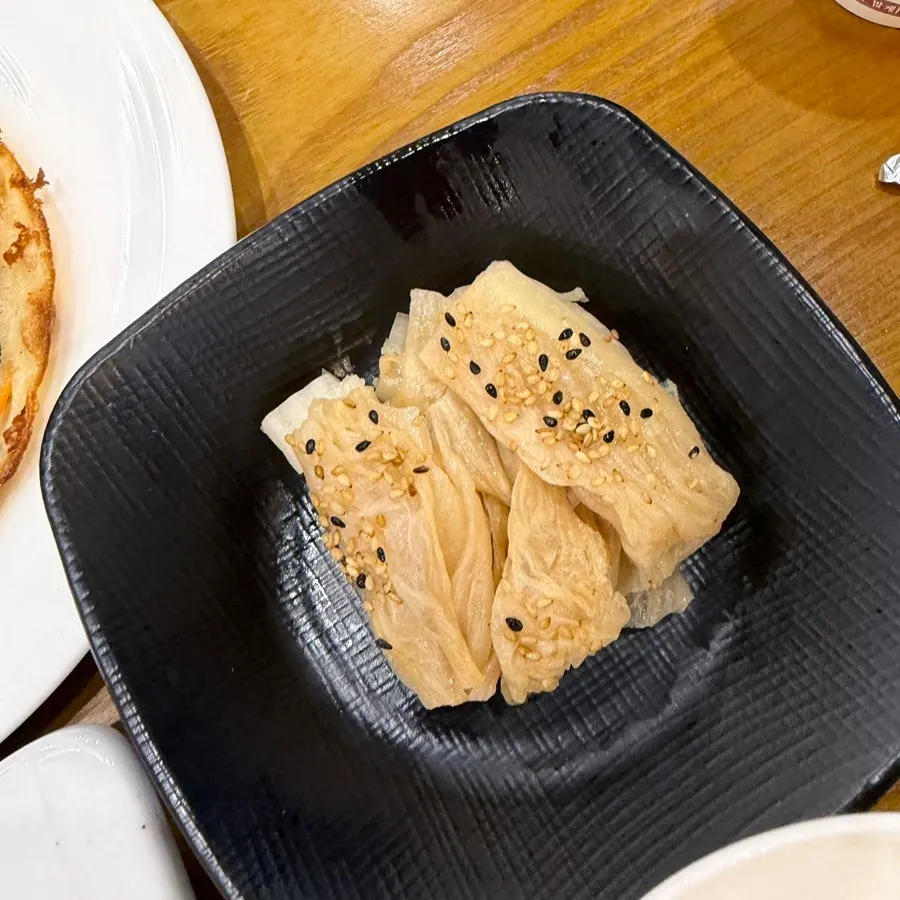 Aged kimchi banchan served with the sashimi