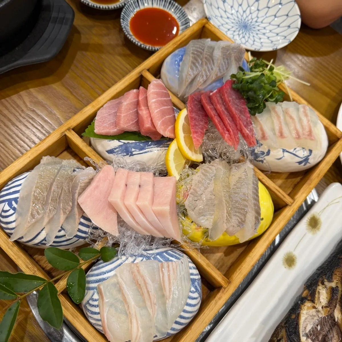 A plate of thickly sliced tuna sashimi