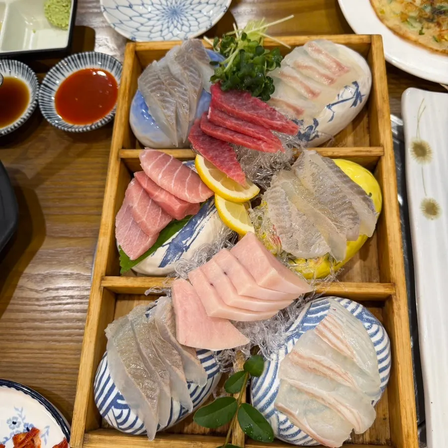A glossy, thick piece of sashimi
