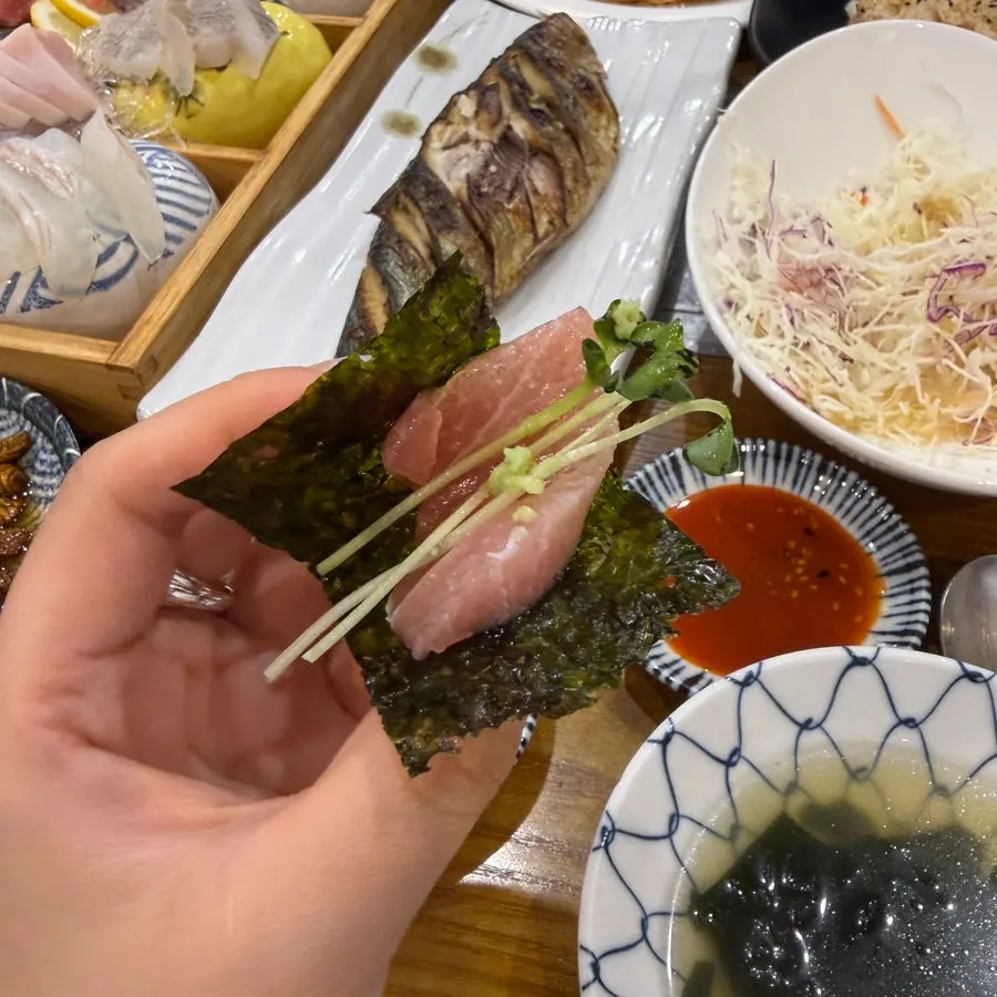 Tuna sashimi and radish sprouts wrapped in seasoned laver