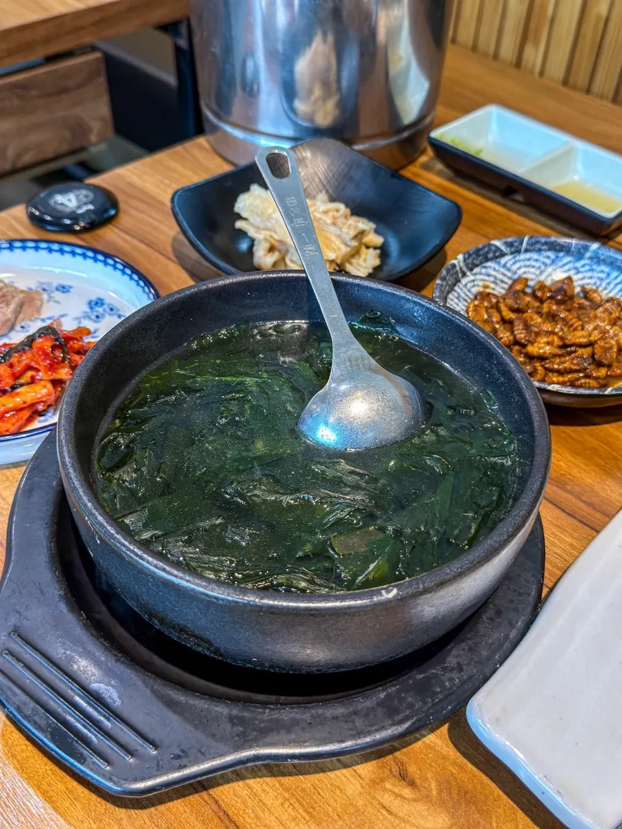 Table set with sashimi and seafood stew together