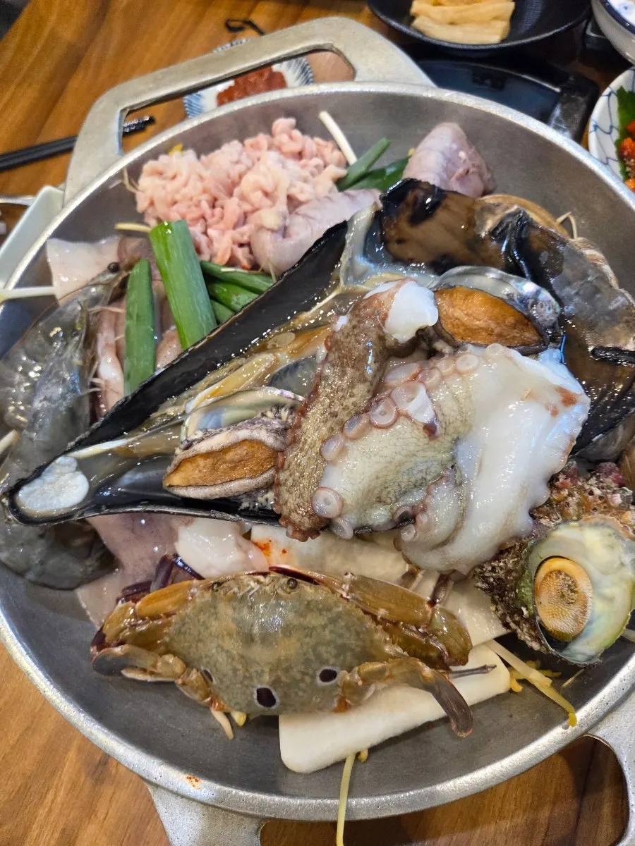 Seafood stew piled high with ingredients