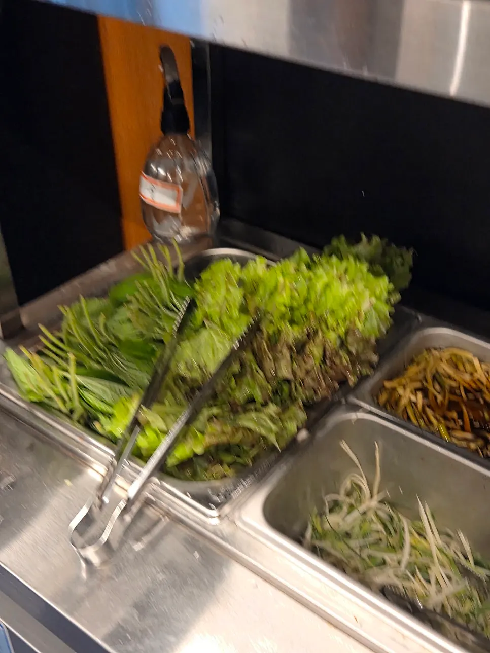 Self-serve bar stocked with a variety of vegetables
