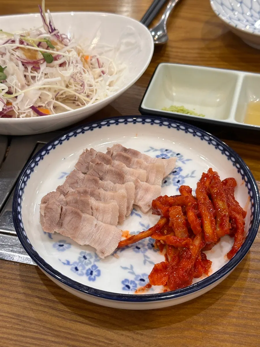Plate of boiled pork with dried radish strips