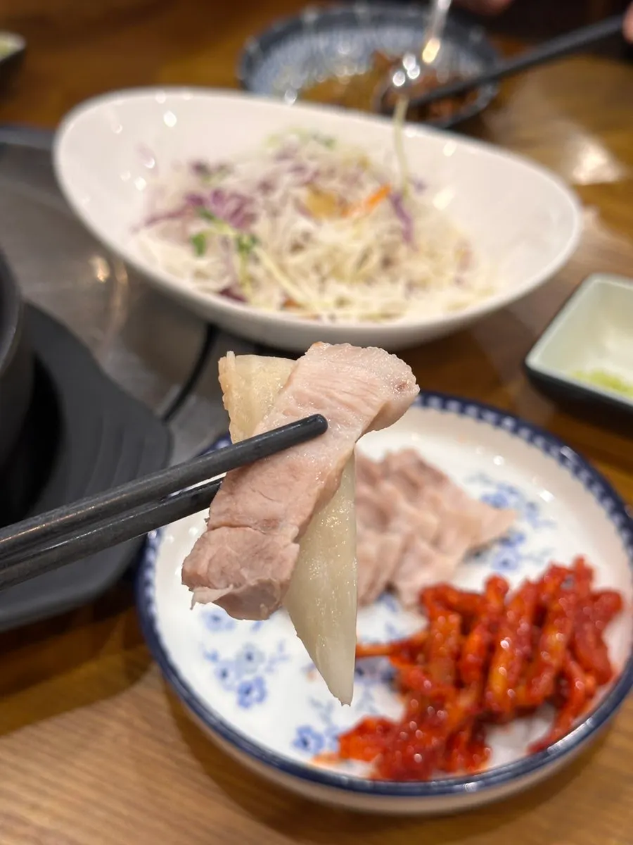 A piece of boiled pork with dried radish strips