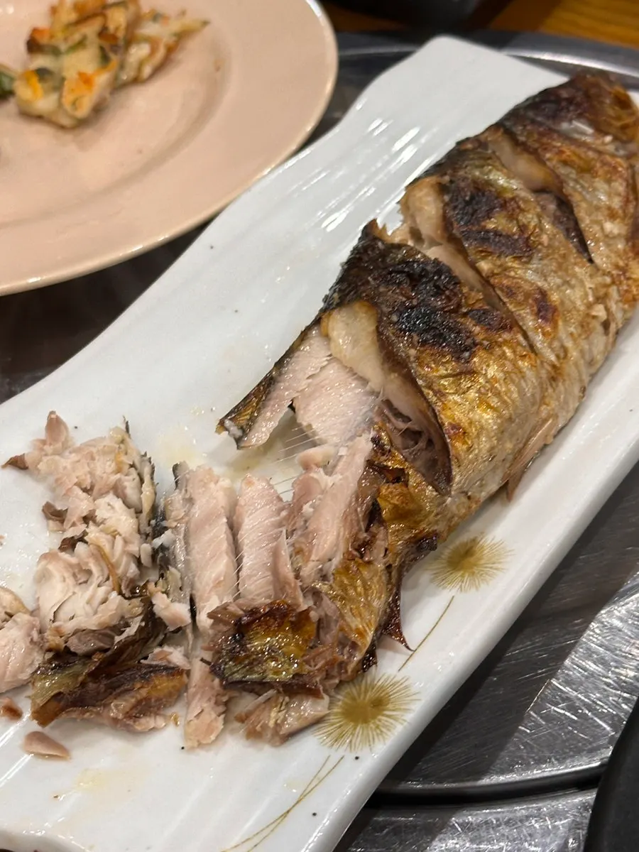 Cross-section of the roe inside the grilled herring