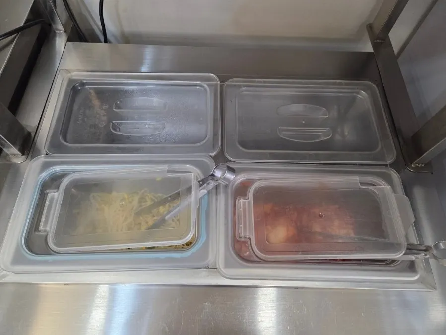 Self-service bar with neatly arranged side dishes
