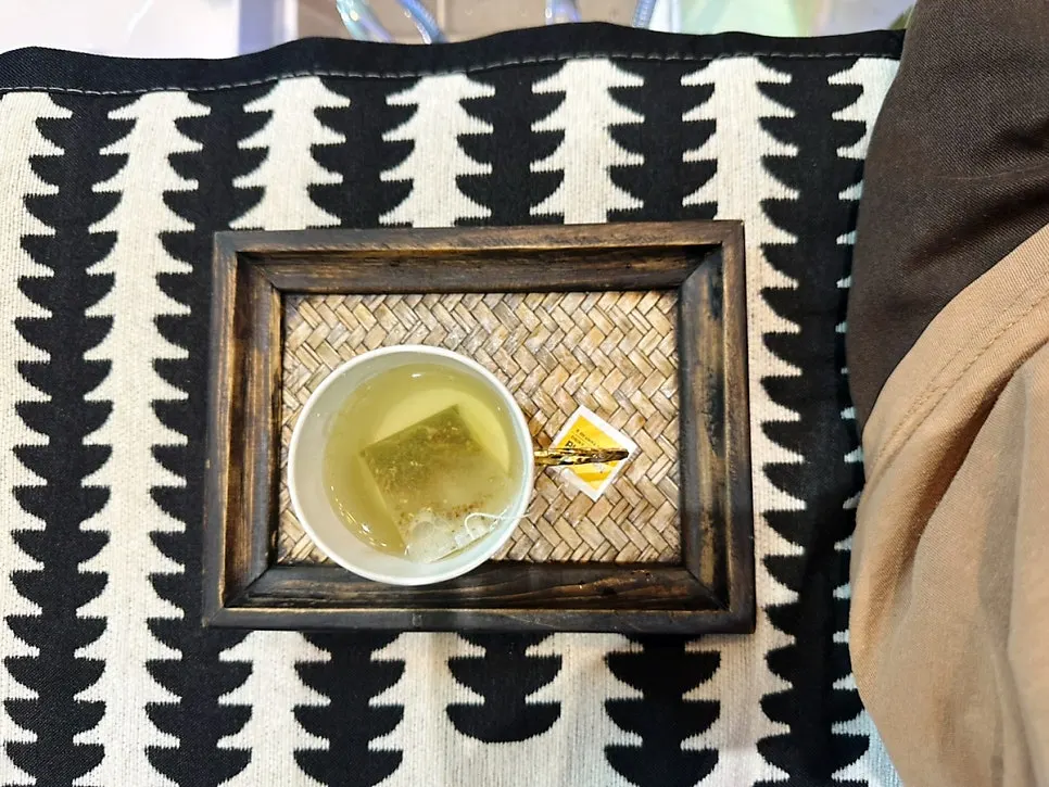 Warm green tea enjoyed during the foot bath