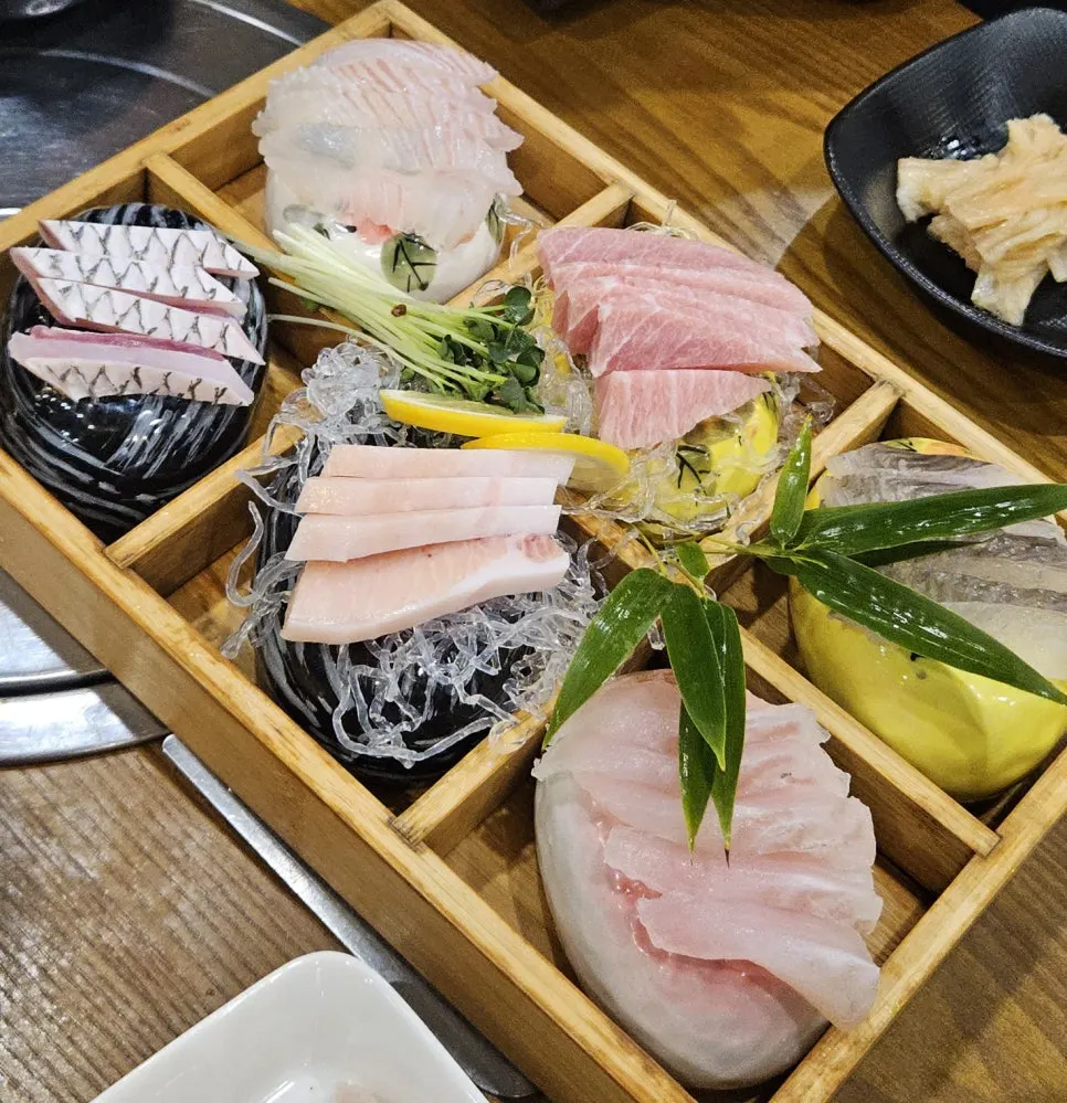 Generous seafood restaurant side dish spread