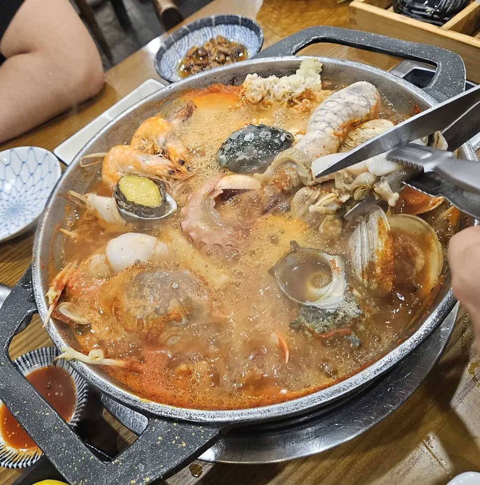 Seafood stew with abalone, sea snail, and blue crab