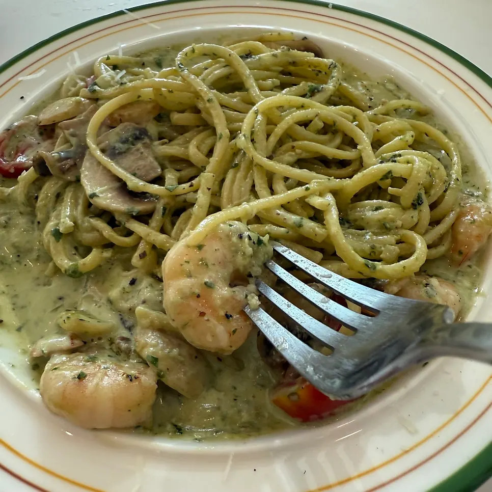 A plate of basil cream pasta