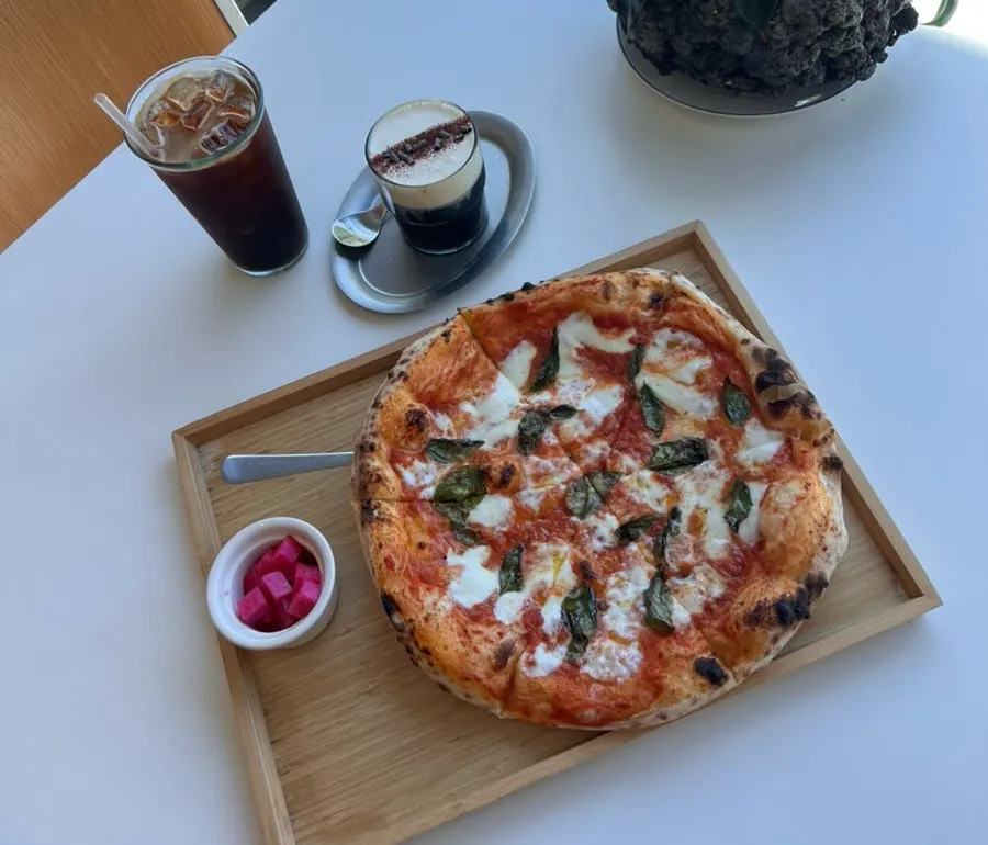 Slice of Margherita pizza with chewy dough