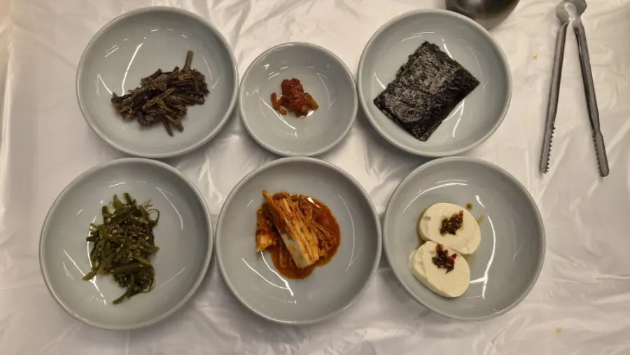Side dishes served in individual porcelain bowls