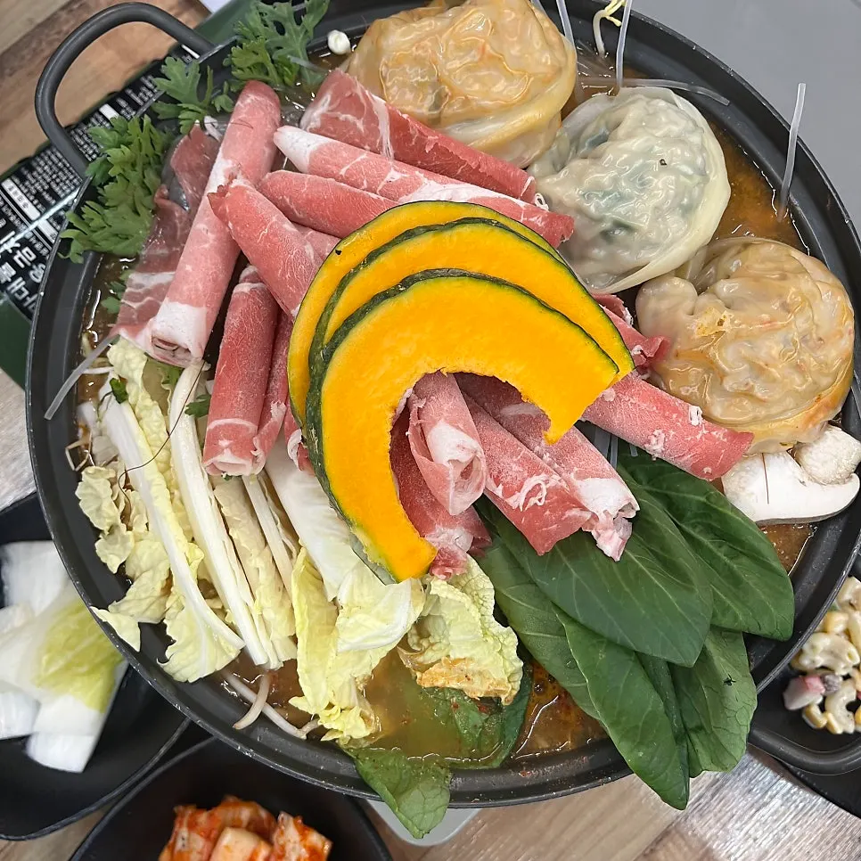 Dumpling hot pot with vegetables and meat