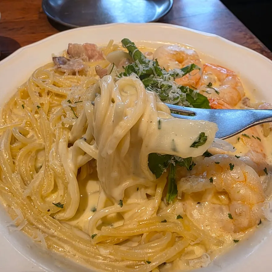 Plate of bacon shrimp cream pasta