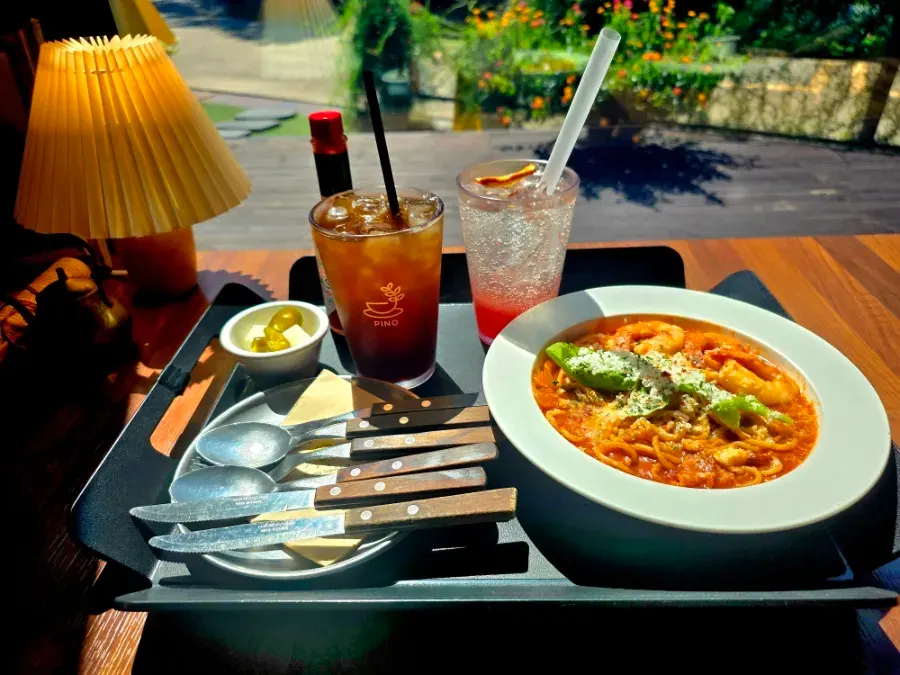 Tomato pasta topped with shrimp