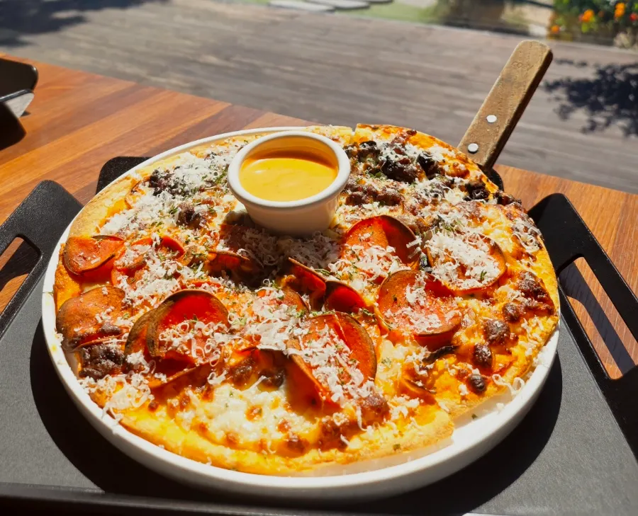 Packed leftover half-and-half pizza