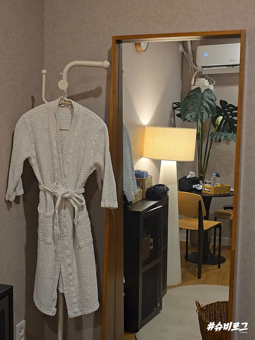Waterproof book and jjimjilbang wear in the cabinet, robe hanging beside it