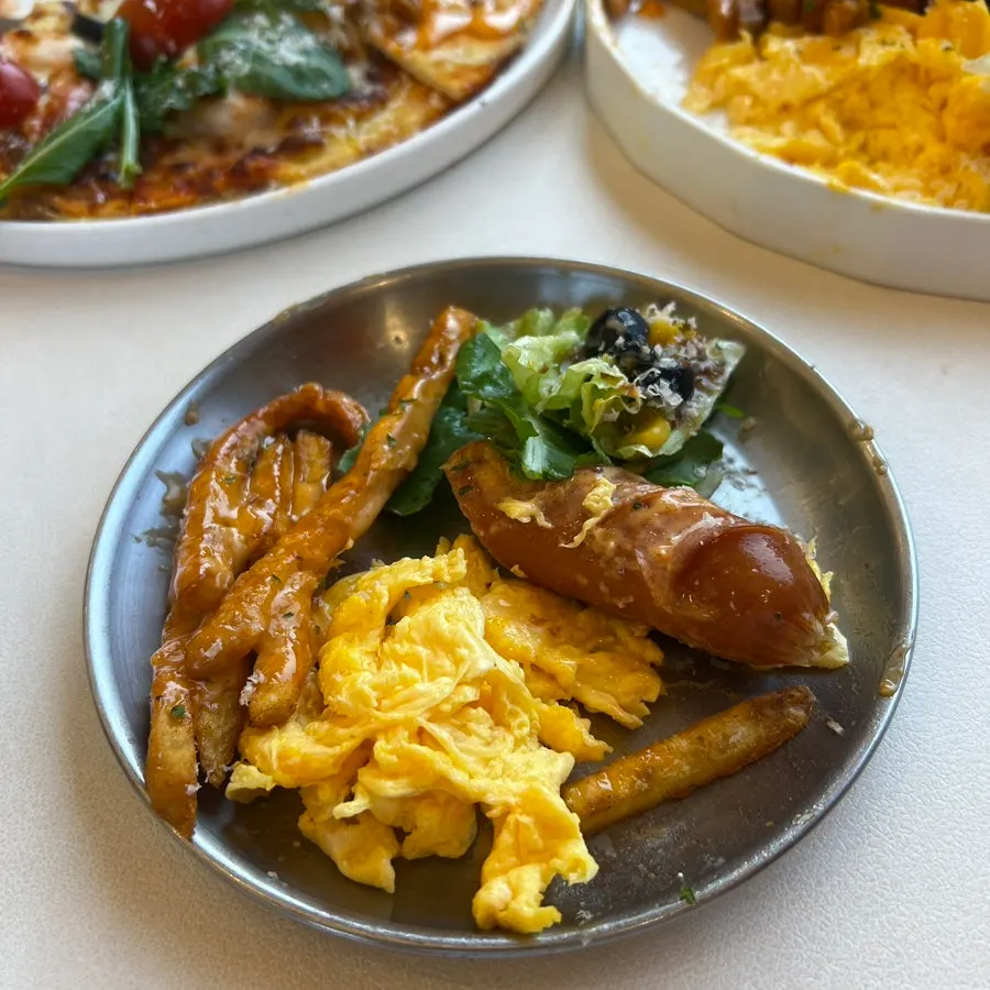Special lunch plate with scrambled eggs and croissant toast