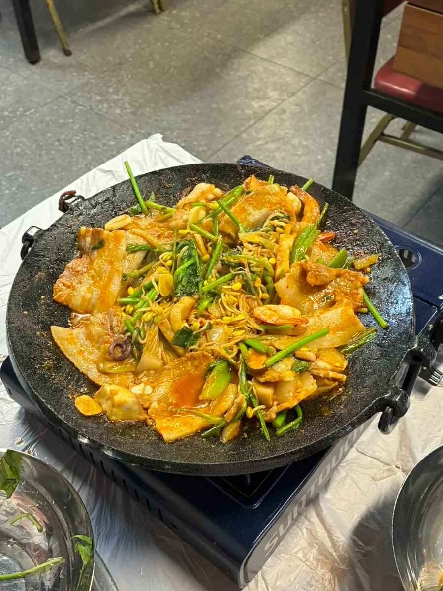 Minari piled over samhap cooked down in sauce