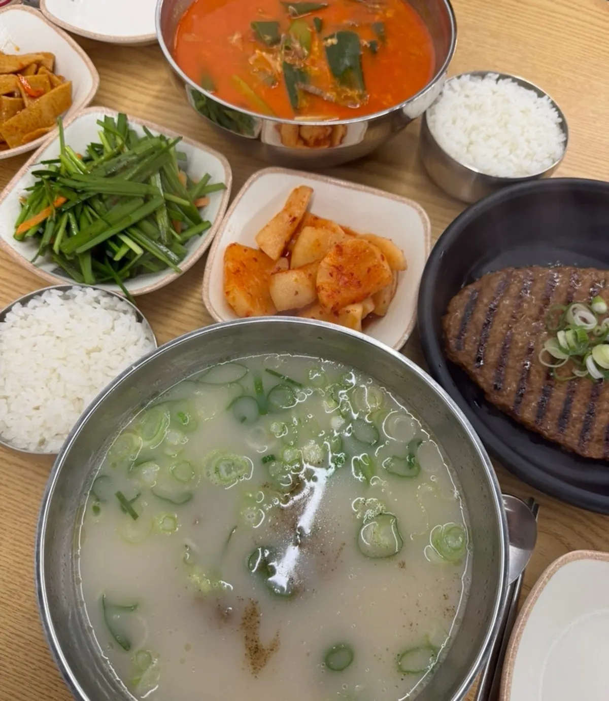 A full spread of traditional yukgaejang and brisket seolleongtang