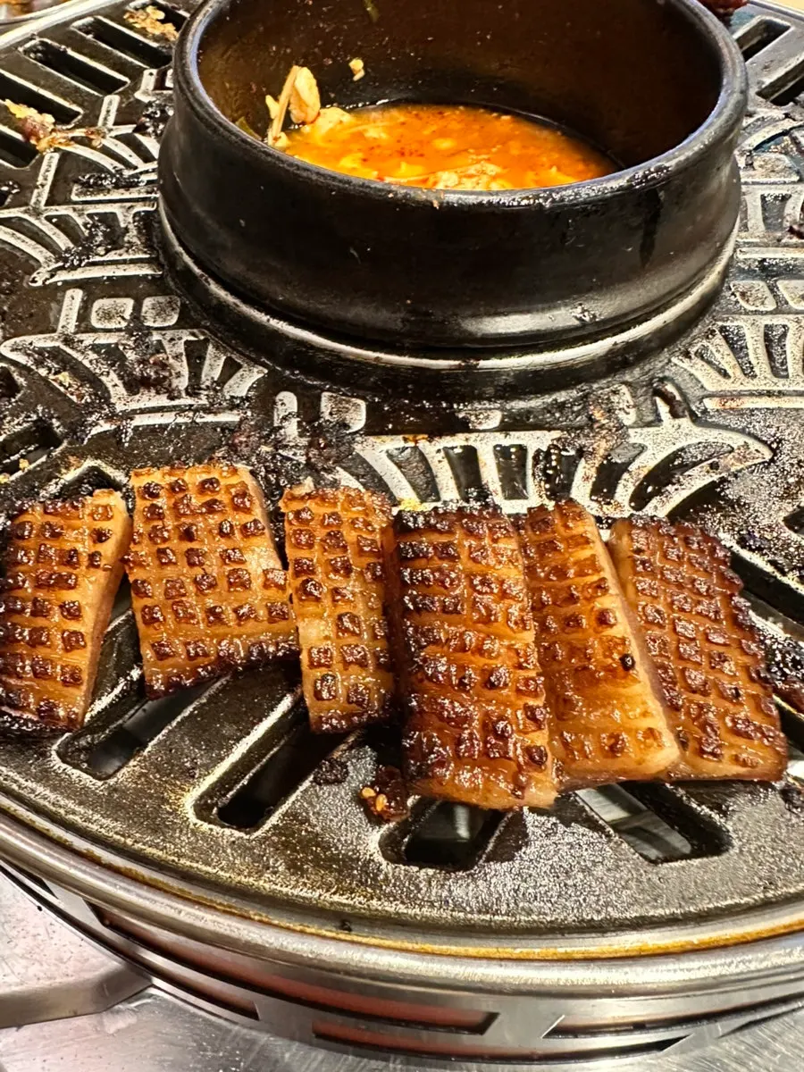 Grilled pork skin with curry powder for dipping