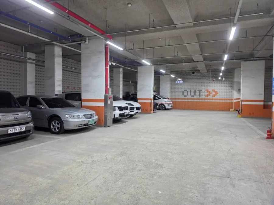 Entrance to the building's basement parking lot next to the restaurant