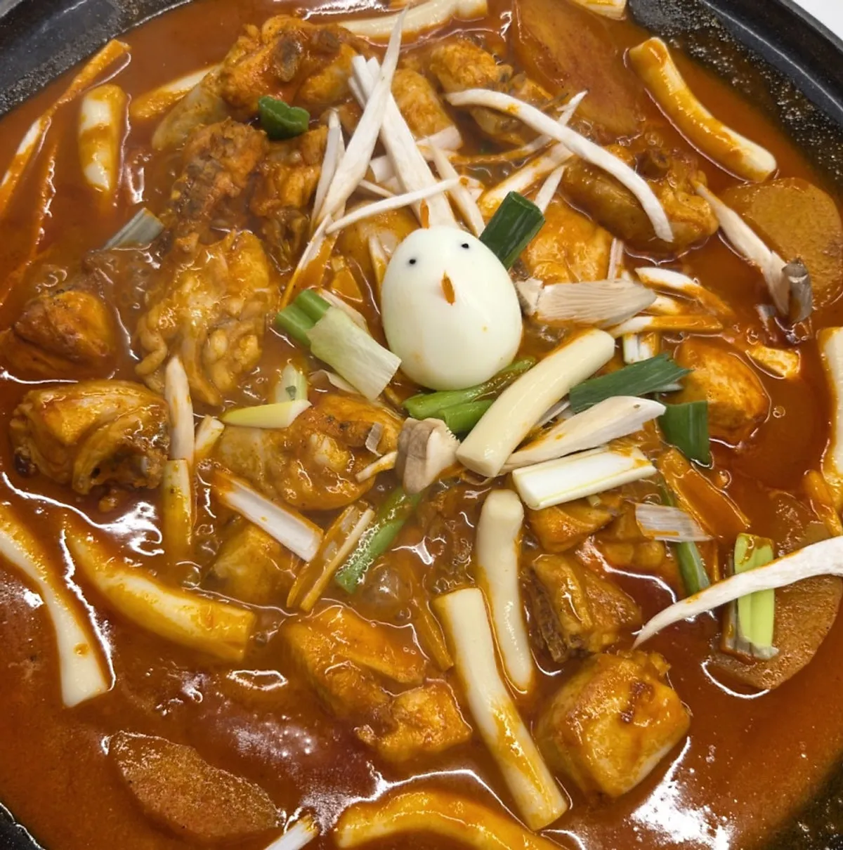 Dak Han Mari chicken stew topped with a chicken-shaped egg