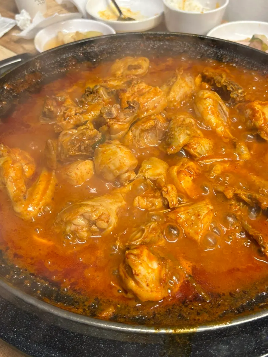 Chicken pulled out coated in spicy-sweet sauce
