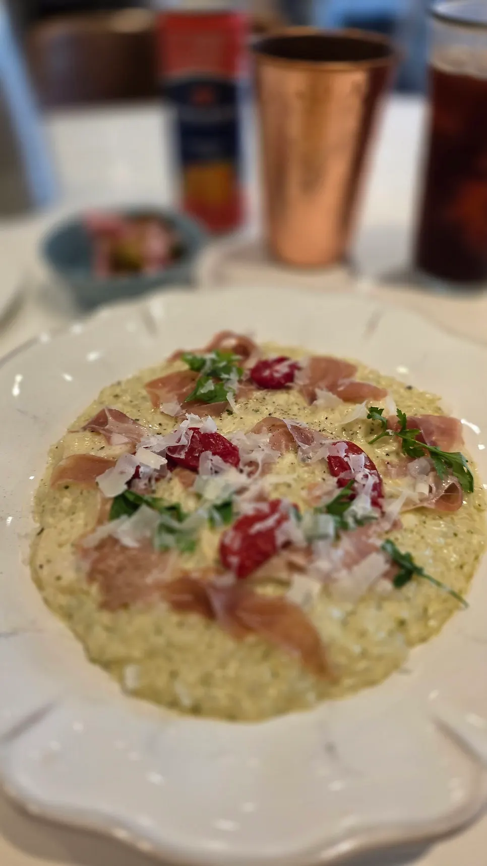 Napoli Shinbu scallop risotto served on a wide plate