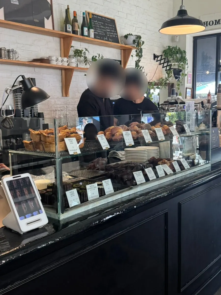 Order counter and dessert display case at Brewers Coffee