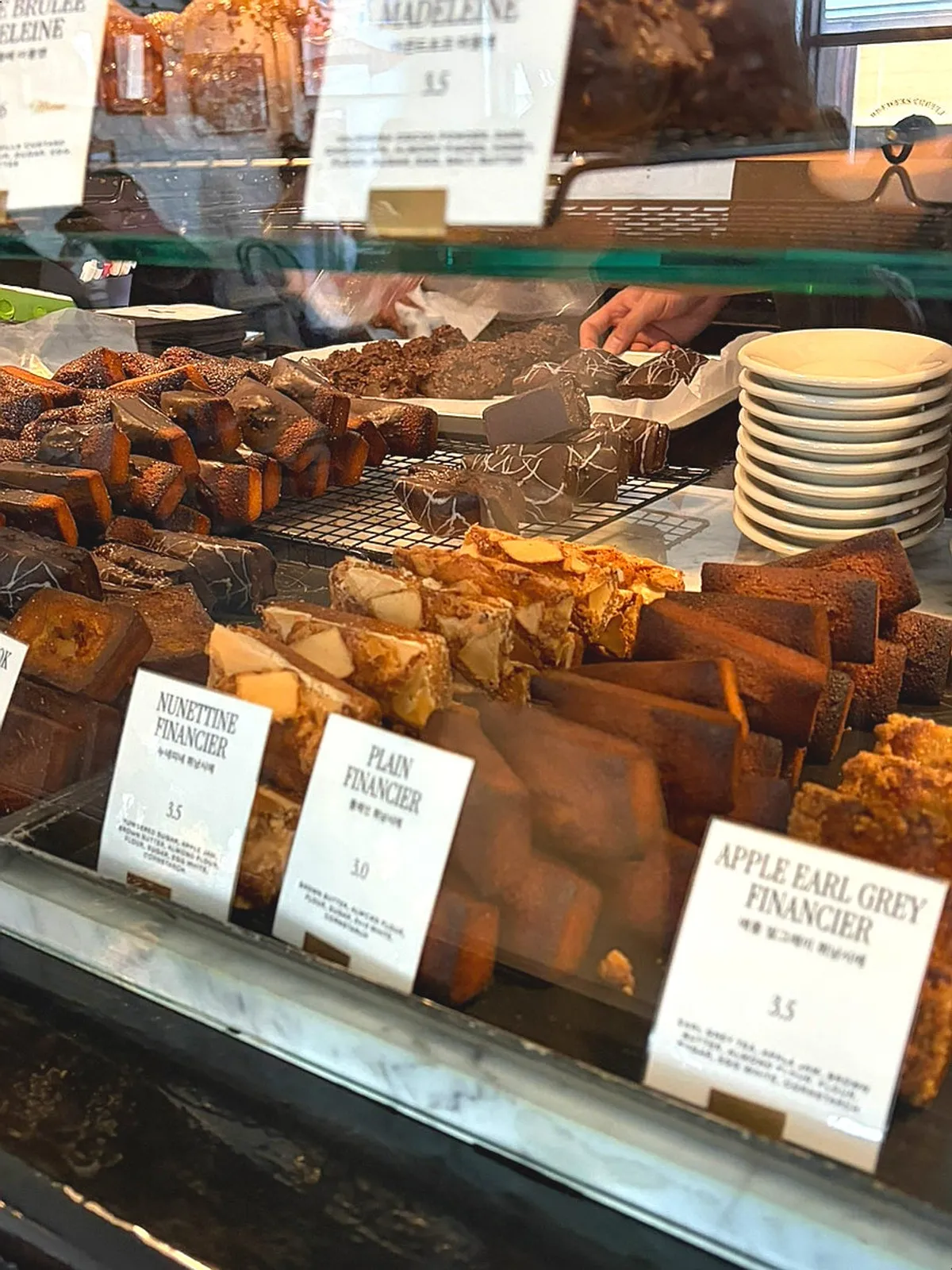 Display case with financiers and madeleines